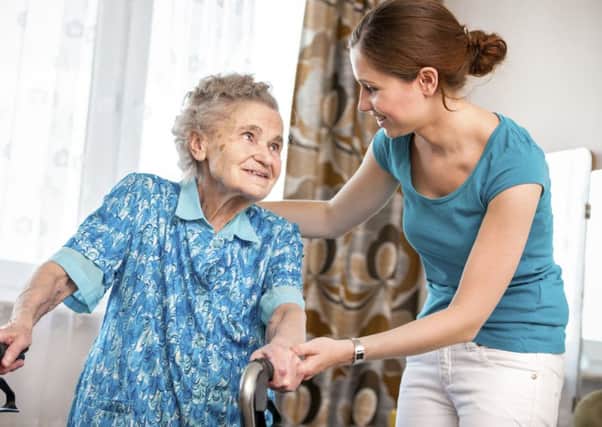 Senior woman with her caregiver at home PPP-150203-142101001