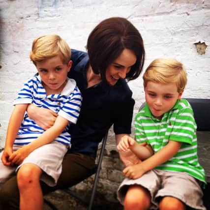 Zac and Oliver Barker with actress Michelle Dockery SUS-151216-105503001
