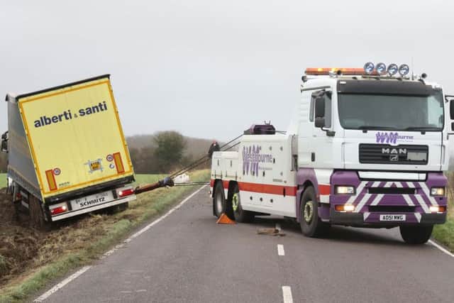 The B2139 at Amberley has been closed after a lorry left the road.