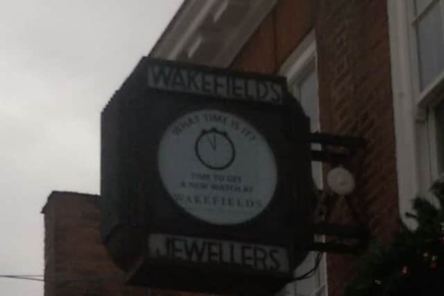 Clock face with the message What time is it? Time to get a new watch at Wakefields