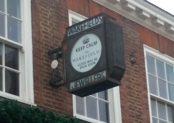Clock face with the message 'Keep calm the Wakefields clock will be back soon