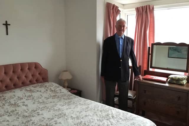 Peter Blackman in the room where a young Jimmy Hill stayed in