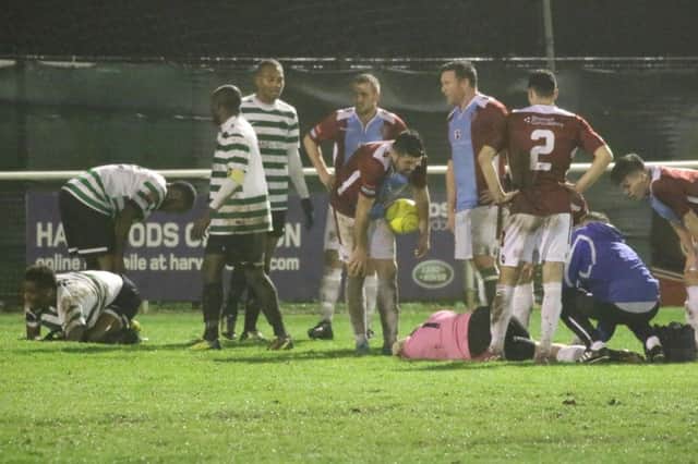 Josh Pelling receives treatment after sustaining a serious injury at Chipstead on Tuesday night. Picture courtesy Joe Knight