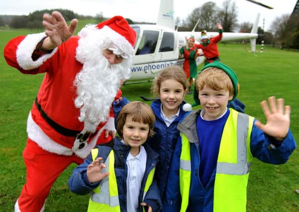 Father Christmas visiting children of West Dean Primary School. Picture: Steve Robards SR1528570
