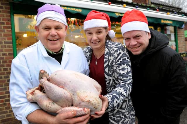 Les Flanagan from Flannagan's Butchers, Crawley Down give turkeys to Charlie Arratoon, and Chris Oxlade for Crawley's Open House. Pic Steve Robards  SR1528910 SUS-151221-190942001