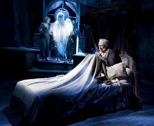 Ghost of Christmas Past and Scrooge (Brendan Lyle). Photo by Mike Eddowes