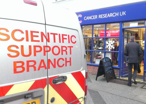 Police investigating the break-in at the Cancer Research UK shop in East Street.