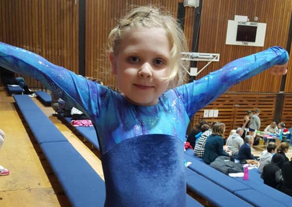Six-year-old Imogen Jones celebrates gaining first place