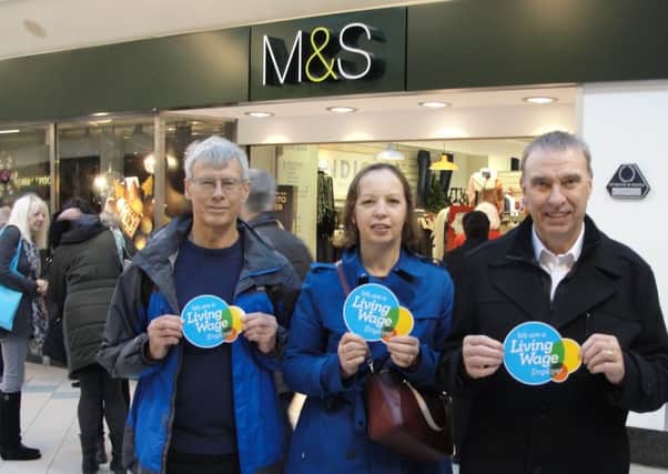 Members of Living Wage Horsham campaigning outside Horsham  M&S calling on them to pay all staff nothing less than the minimum wage (photo submitted). SUS-151222-161740001