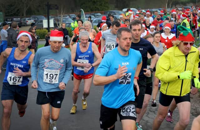 Runners set off in the Christmas Pudding Dash at Ashburnham Place. Picture by Justin Lycett (SUS-151220-092206001)