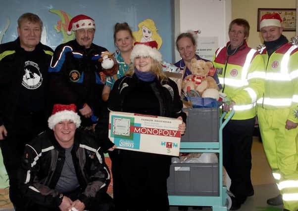 Service by Emergency Rider  Volunteers (SERV) team up with West Sussex Bikers' Motorcycle Club to deliver Toys to Sussex Children in Hospital over Christmas.

Conquest Hospital, Hastings. SUS-151228-090633001