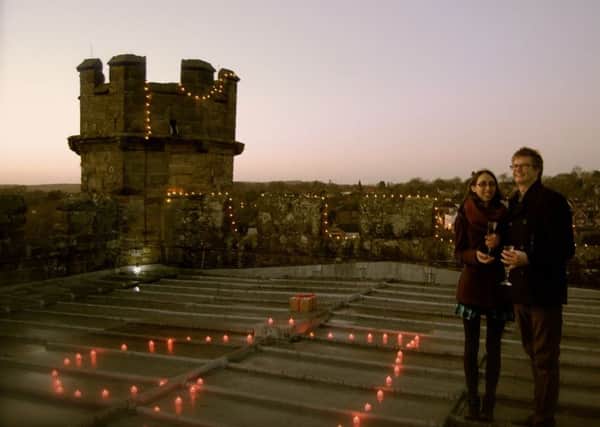 Tom Gray and Judi after she said yes to his proposal on the Battle Abbey Gatehouse roof on Christmas Eve