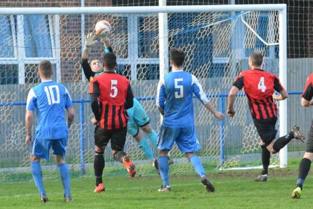 Simon Lehkyj stretches to keep out a free kick. Picture by Grahame Lehkyj