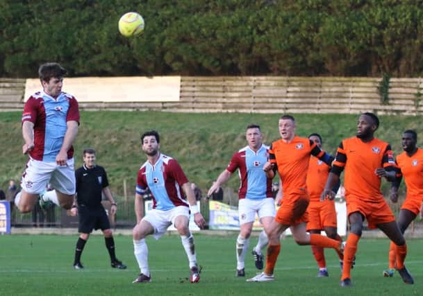 Jack Walder heads for goal during Hastings United's 1-0 win at home to Walton Casuals on Boxing Day. Picture courtesy Scott White