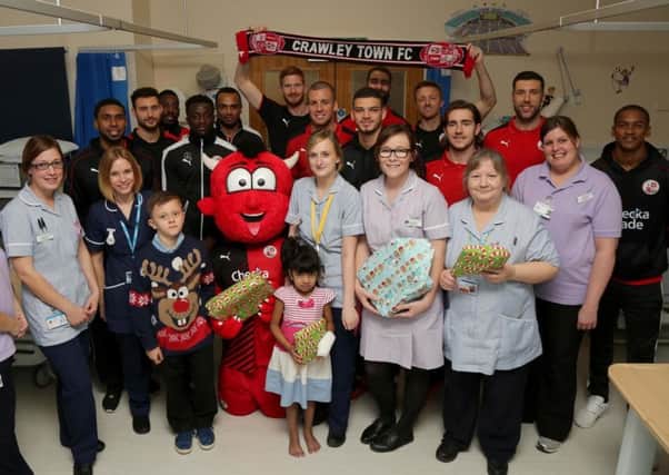 Crawley Town players spread some festive cheer at East Surrey Hospital. Picture by James Boardman/ Telephoto Images SUS-151229-102320002