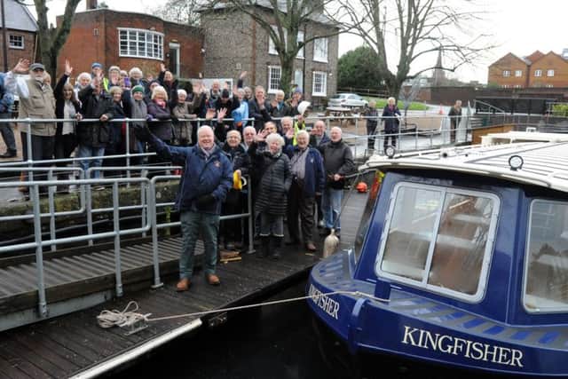 Members of Chichester Ship Canal Trust and volunteers next to the new trip boat. ks1500002-3