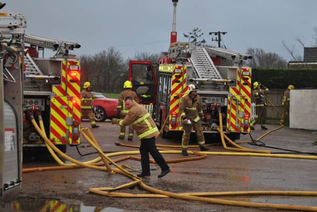 Firefighters on the scene of a blaze at the Brewers Arms pub, Vines Cross SUS-160301-104330001
