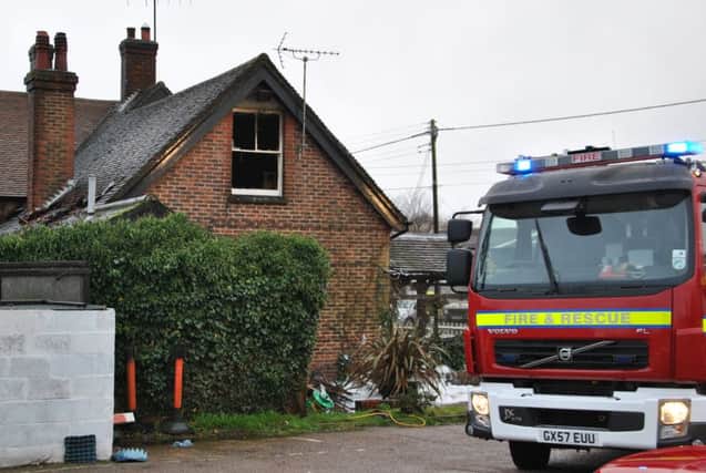 Firefighters on the scene of a blaze at the Brewers Arms pub, Vines Cross SUS-160301-104341001