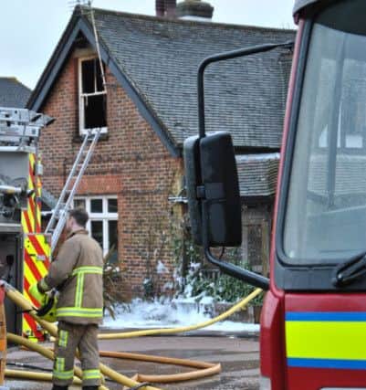 Firefighters on the scene of a blaze at the Brewers Arms pub, Vines Cross SUS-160301-104352001