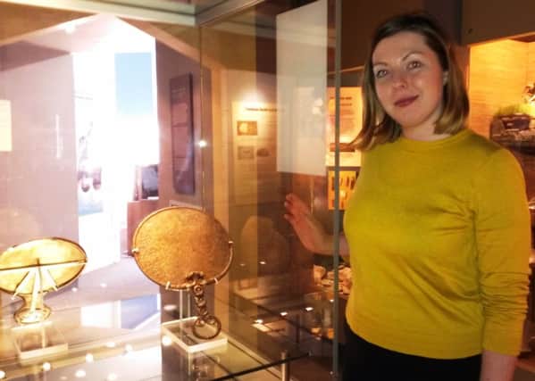 Littlehampton Museum curator Kathleen Lawther with the Holcombe mirror