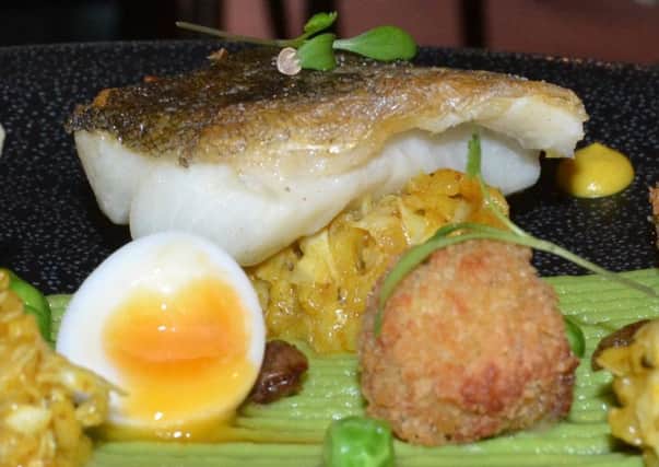 Kedgeree dressed up for dinner with arancini and pea puree