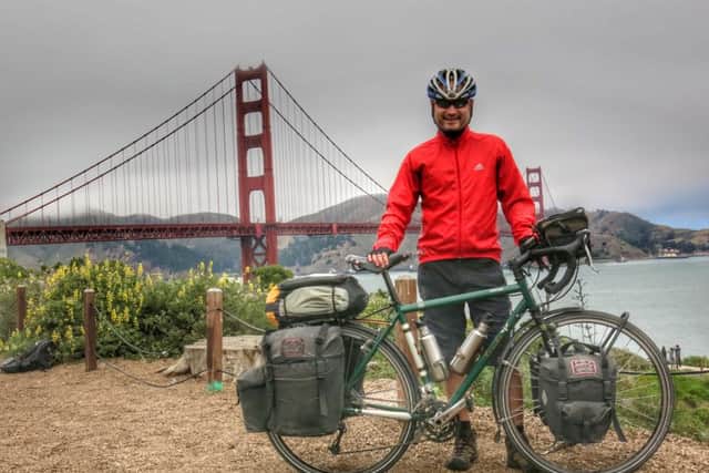Slinfold man Neil Churchard cycled around the world to raise money for Unicef. Pictured at the USA's Golden Gate Bridge - picture submitted