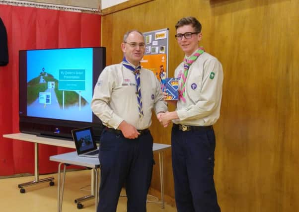 Tim Taylor, the Deputy County Commissioner for Scouting in West Sussex came to Ifield Scout headquarters to present both the Duke of Edinburghs Gold Award and the Queens Scout Award to Jamie Keeley, from Furnace Green, who has become a Queens Scout, the highest training award in the Scout Movement - picture submitted