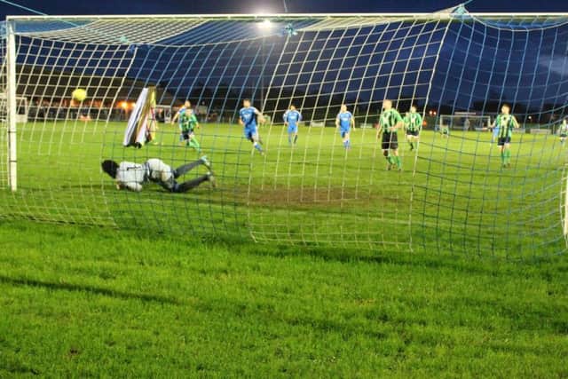 Leiston keeper makes a top penalty save.