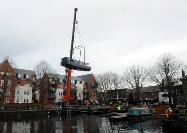 Kingfisher is craned into the basin at Chichester. Kate Shemilt ks1500002-1