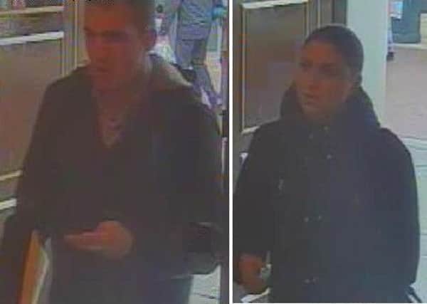 Police want to speak to this man and woman over the theft. CCTV image released by Sussex Police