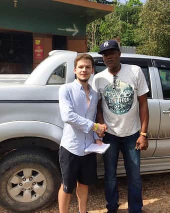 Dylan Legrand with Usain Bolt's father SUS-161101-164911001