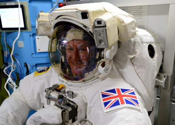 Tim Peake tries on his suit before his historic spacewalk on Friday   PHOTO: Twitter