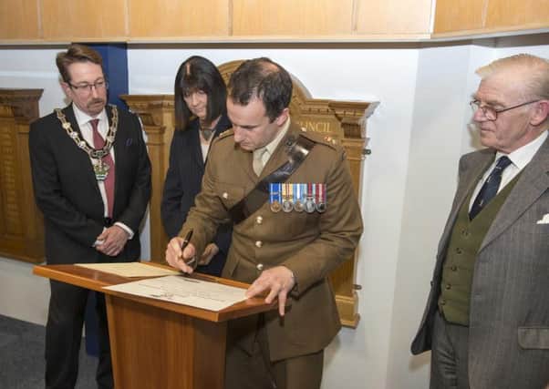 Arun's military community covenant is signed. Picture by Peter Savage