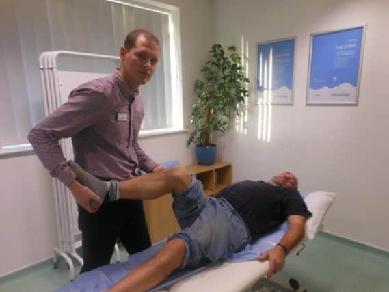 Toby Lambourne (ESP) with Patient Tony Poore at the Peacehaven clinic SUS-160113-101217001
