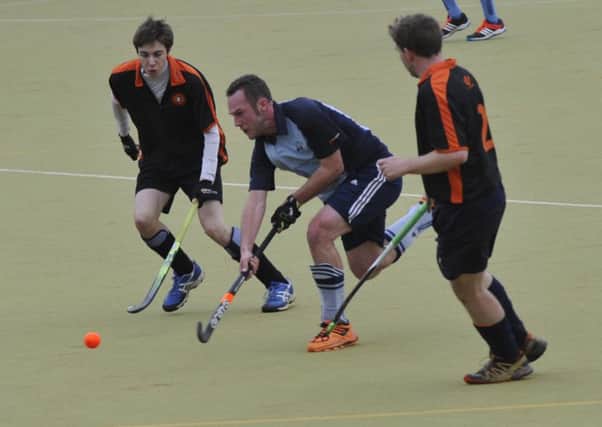 Gavin Cload in the thick of the action for South Saxons against Penguin. Picture by Simon Newstead (SUS-160901-221057002)