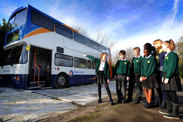 Holmbush Primary Academy now has a bus in the playground which is going to be used as an outdoor classroom/learning environment. Pic Steve Robards   SR1601365 SUS-160113-180504001