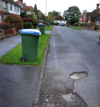 Potholes in Springfield Crescent, Horsham in 2013. Photo by Steve Cobb S13411205x