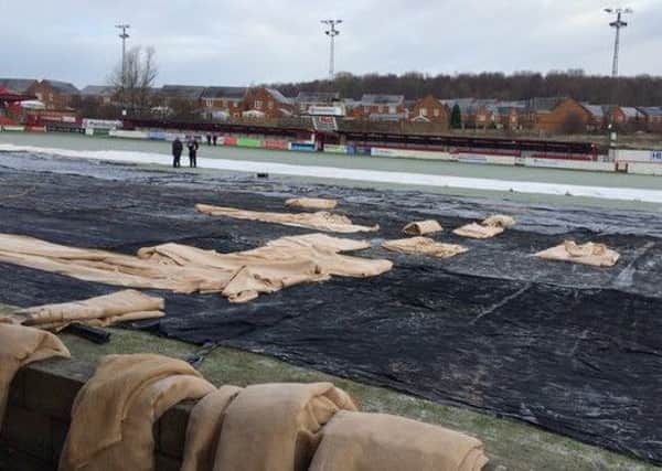 The Crown Ground pitch covers couldnt prevent a frozen pitch before kick-off Picture: @ASFCofficial