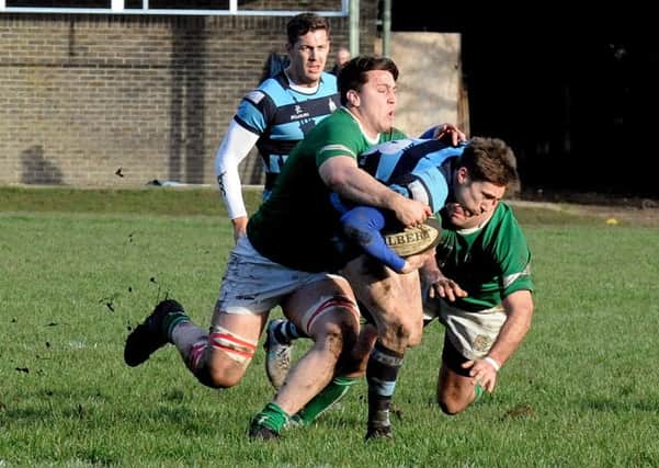 Jack Maslen bursts through two tackles / Picture by Kate Shemilt
