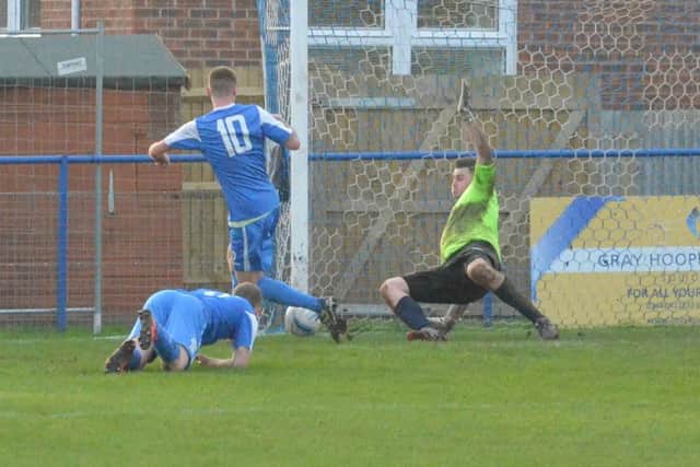 Rob O'Toole tests the Ringmer keeper. Picture by Grahame Lehkyj