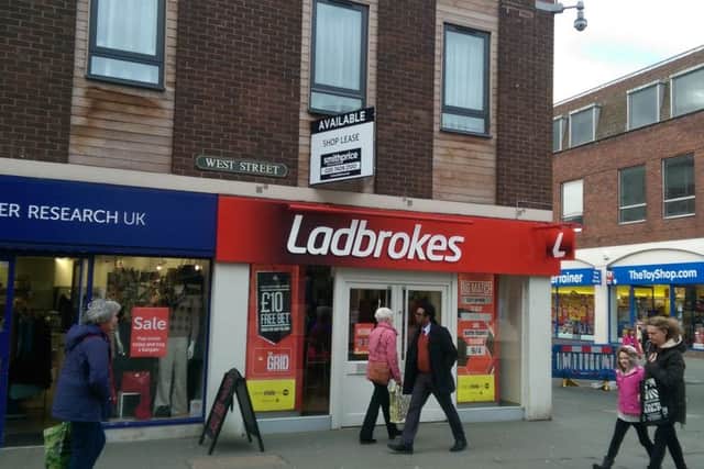 Shop lease sign above Ladbrokes in West Street.