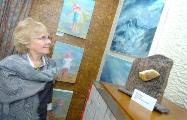 Art 22, Clifford Avenue, Eastbourne Festival 14/04/12 Sylvia Hassell with her paintings ENGSUS00120120414133503