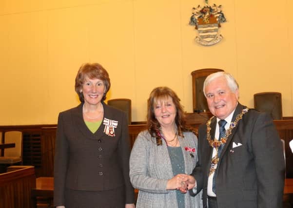 The Lord Lieutenant of West Sussex Susan Pyper presented the Medal of the Order of the British Empire to Susan Ward with mayor Michael Donin