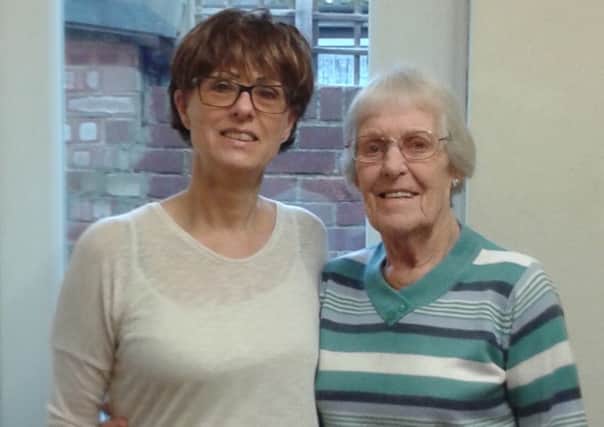 Ali Howell from Copthorne has pledged to raise Â£500 for Alzheimer's Research UK after befriending Janie, 88, just over a year ago - picture submitted