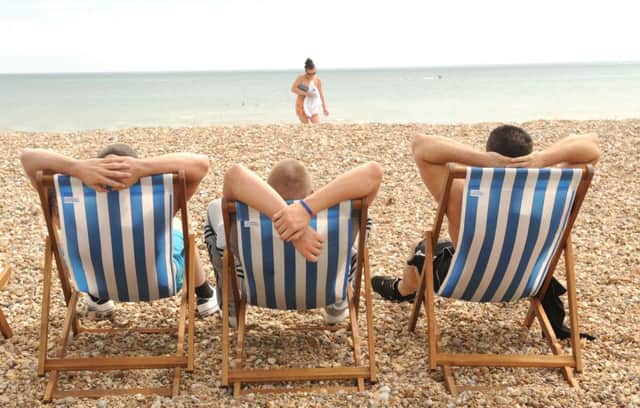 Lads, just being lads!  - Relaxing on Bognor beach.

Picture by Louise Adams C131001-2 Bog Hot Weather ENGSUS00120130722140100