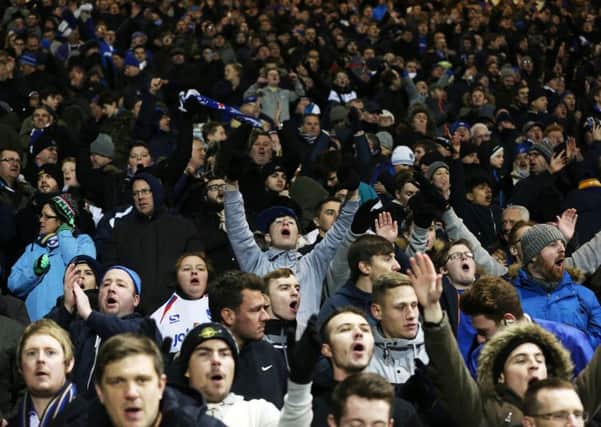 Pompey fans cheering on the Blues against Ipswich on Tuesday night. Picture: Joe Pepler