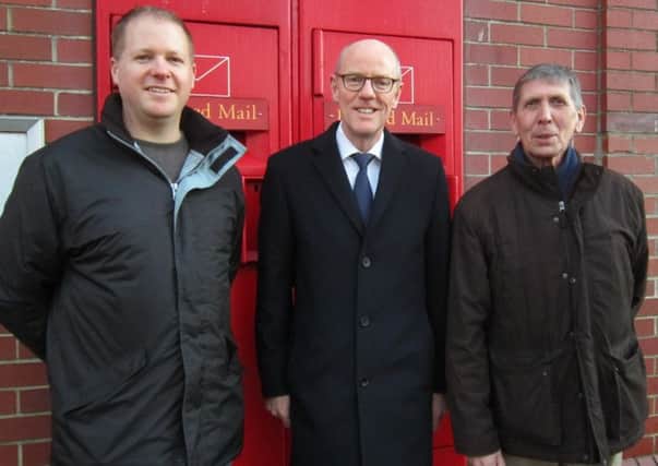 From left: Paul Wells, Nick Gibb and Pat Dillon outside the main post office