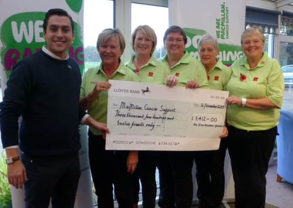 Ifield Golf Club's Sally Brown and her 72 hole team presenting a cheque to James Bacharew from MacMillan Cancer Support. SUS-160118-154740002