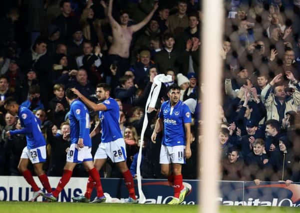 The Pompey players and fans celebrate Gary Roberts opener against Ipswich on Tuesday night Picture: Joe Pepler