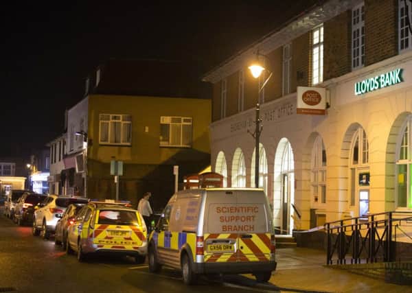 Police cars outside Shoreham Post Office after an armed robbery SUS-160123-094324001